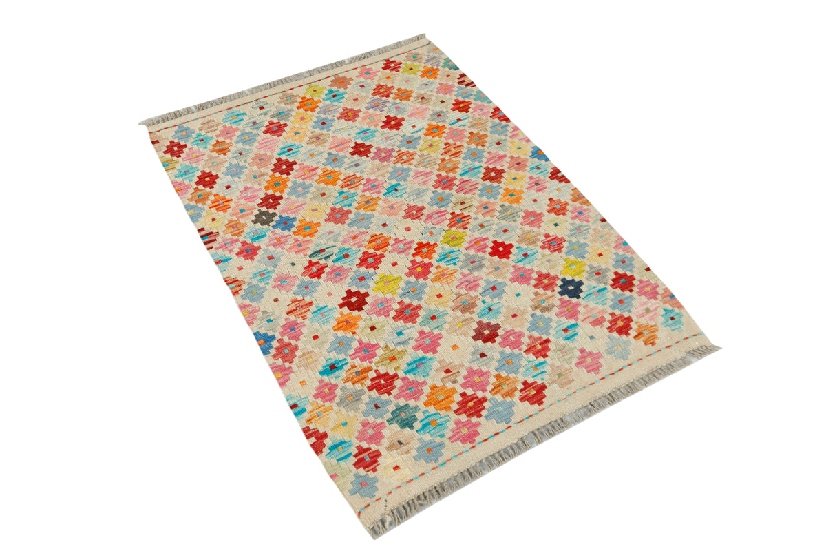 Afghan Kilim rug from eastofhere, 115x83cm, featuring colorful geometric patterns on woven textile.