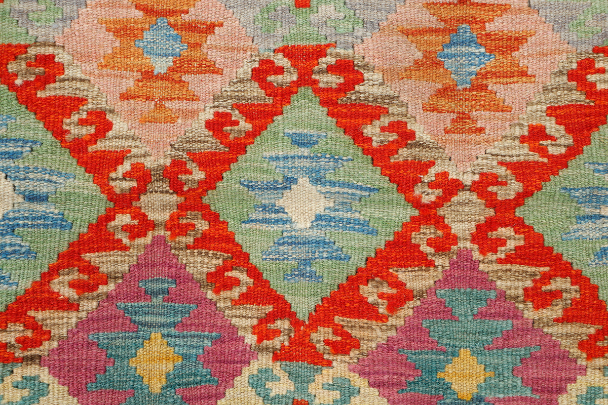 Afghan Kilim rug by eastofhere, 118x87cm, featuring vibrant geometric patterns and traditional woven design.