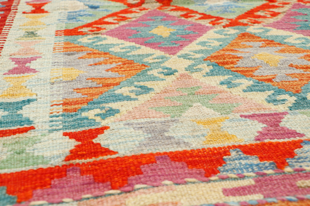 Afghan Kilim rug from eastofhere with geometric patterns, measuring 118x87cm, showcasing vibrant traditional woven textile.