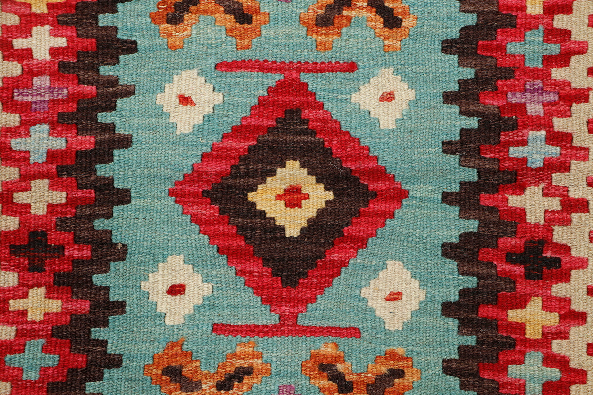 Afghan Kilim rug by eastofhere, 123x78cm, featuring vibrant geometric patterns and traditional weaving on a flat textile surface.