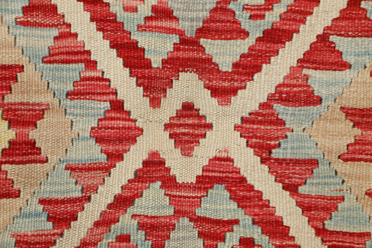 Afghan Kilim rug by eastofhere in 109x77cm, featuring traditional geometric patterns and vibrant woven textile design.