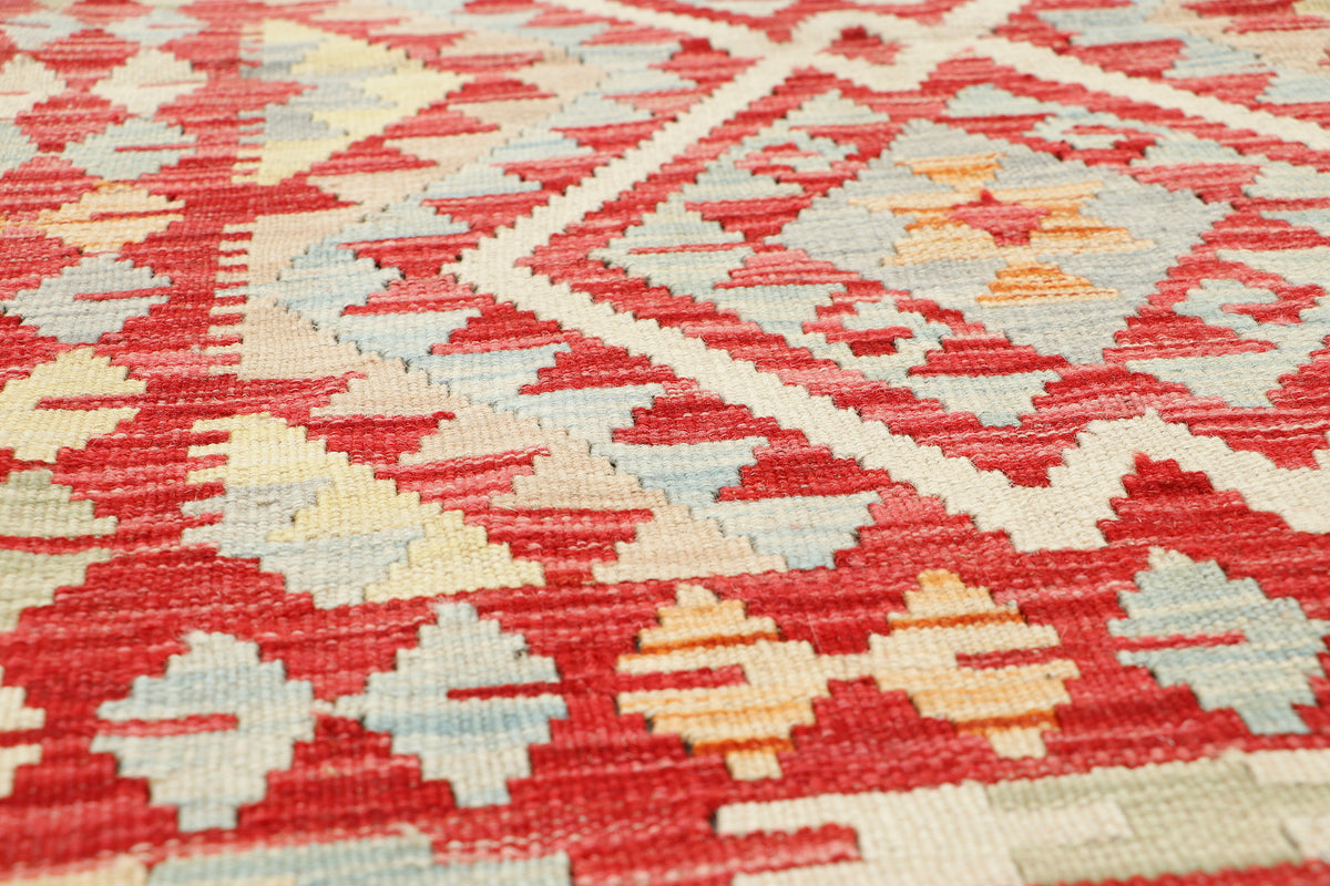 Colorful Afghan Kilim rug by eastofhere, featuring traditional geometric patterns, measuring 109 by 77 cm, flat-woven textile.