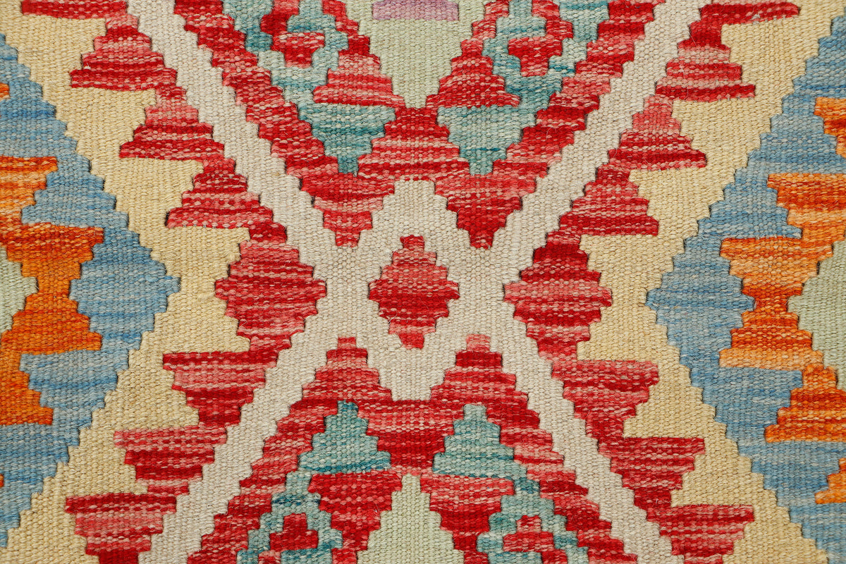 Afghan Kilim rug by eastofhere, 108x78cm, featuring traditional geometric patterns and vibrant colors on woven fabric.