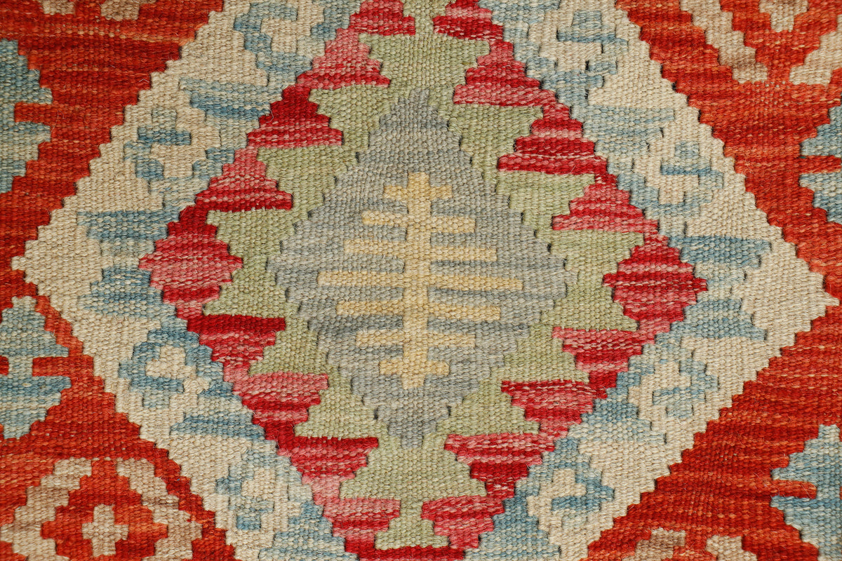 Afghan Kilim rug by eastofhere, 113x77cm, featuring traditional geometric patterns in vibrant colors on woven textile.