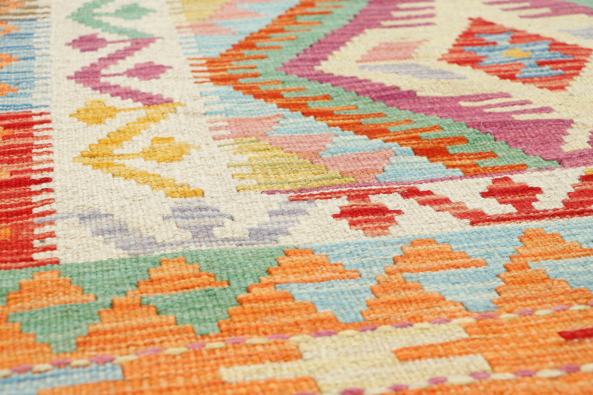 Afghan Kilim rug by eastofhere showcasing colorful geometric patterns, 118x85cm, traditional woven textile for home decor.