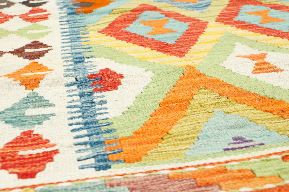 Afghan Kilim rug with geometric patterns in vibrant colors, measuring 116x92cm, by eastofhere, showcasing traditional woven textile design.