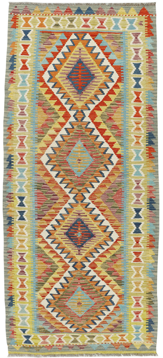 Afghan Kilim runner rug by eastofhere, 195x84cm, featuring traditional geometric patterns in vibrant colors.