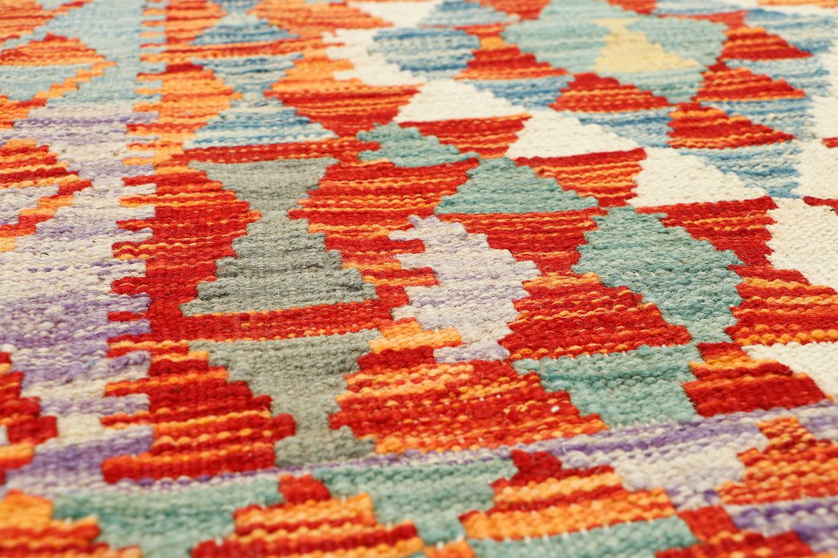 Afghan Kilim runner rug by eastofhere, 190x73cm, featuring traditional geometric patterns in vibrant colors.