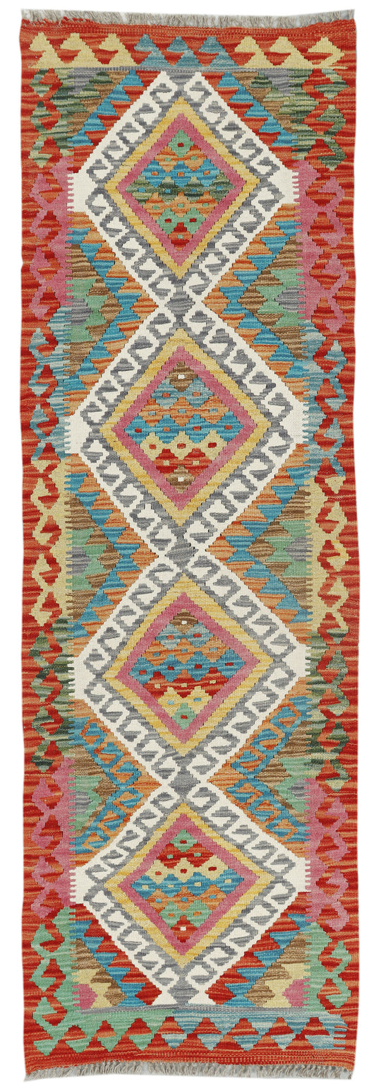 Afghan Kilim runner rug by eastofhere, 195x58cm, featuring traditional geometric patterns and vibrant colors on a woven textile.