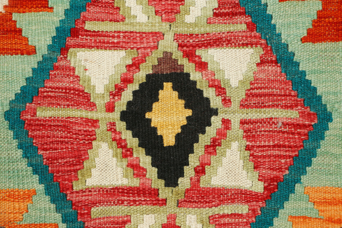 Afghan Kilim runner rug by eastofhere, 216x65cm, featuring traditional geometric patterns on woven textile.