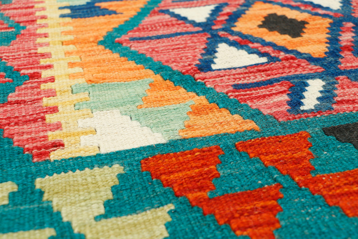 Afghan Kilim runner rug by eastofhere, 216x65cm, featuring traditional geometric patterns and vibrant colors.