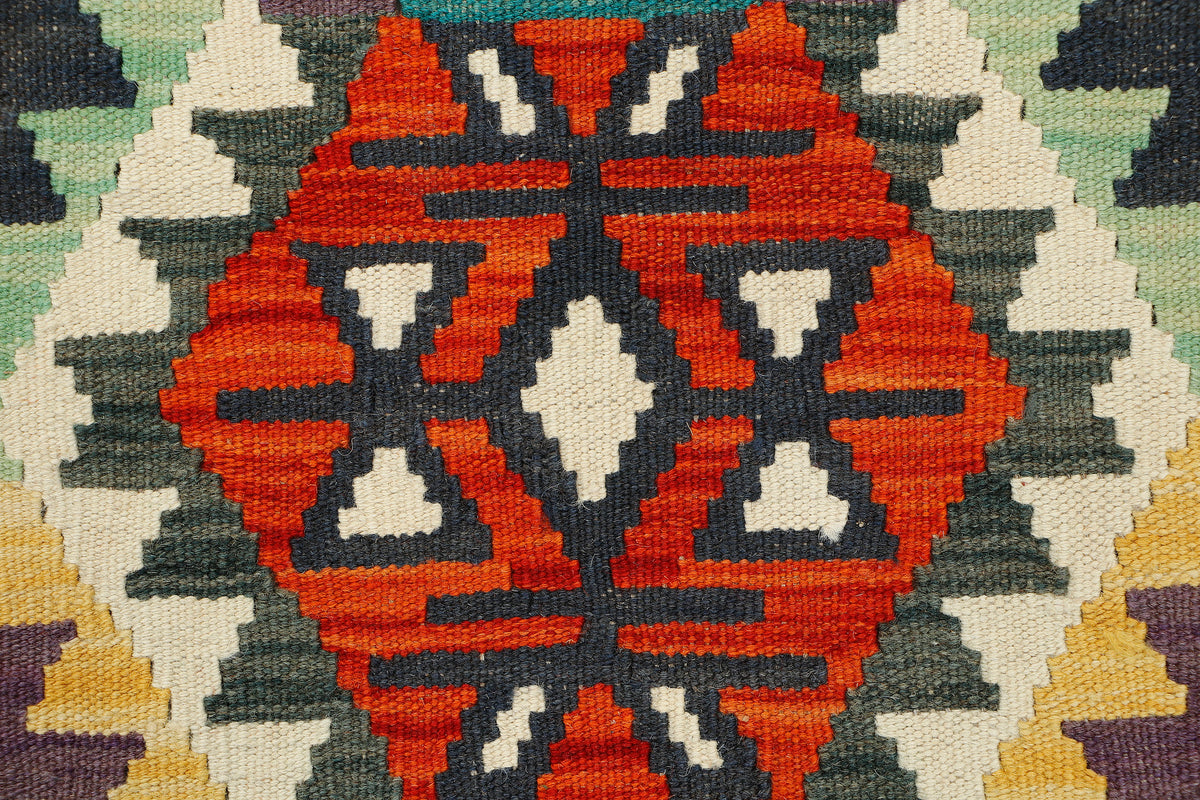 Afghan Kilim runner rug by eastofhere, 189x61cm, featuring vibrant geometric patterns and traditional woven design.