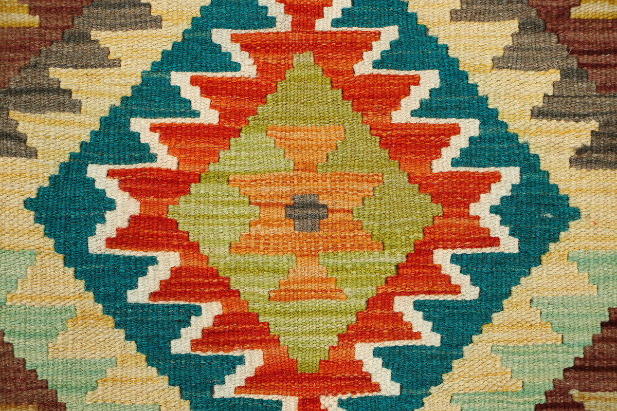 Afghan Kilim runner rug from eastofhere, 200x60cm, featuring traditional geometric patterns in vibrant colors on woven fabric.