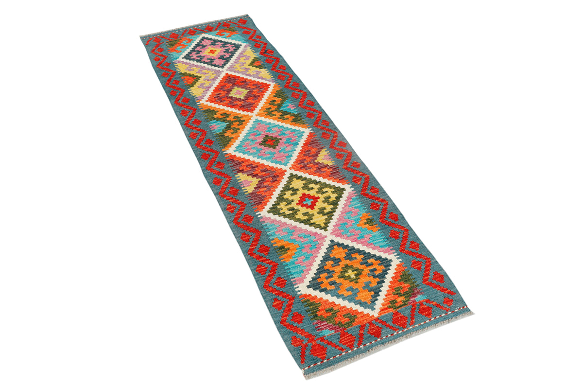 Afghan Kilim runner rug by eastofhere, 190x57cm, featuring traditional geometric patterns and vibrant colors on woven fabric.