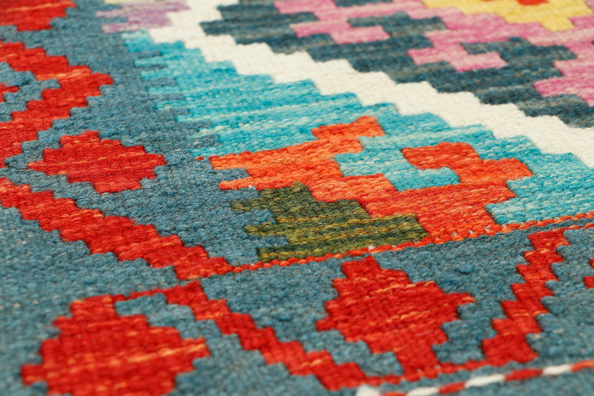 Afghan Kilim runner rug by eastofhere, 190x57cm, featuring traditional geometric patterns on woven textile.