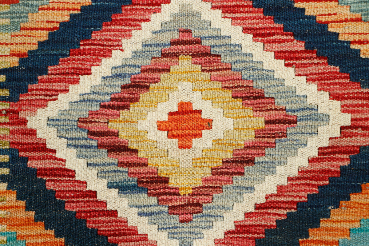 Afghan Kilim runner rug from eastofhere, 197x68cm with traditional woven geometric patterns and vibrant colors.