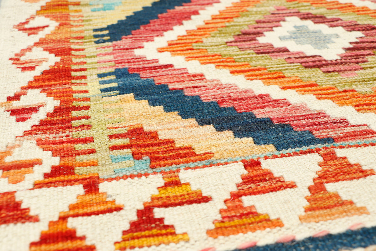 Afghan Kilim runner rug by eastofhere, 197x68cm, featuring traditional geometric patterns in vibrant colors.