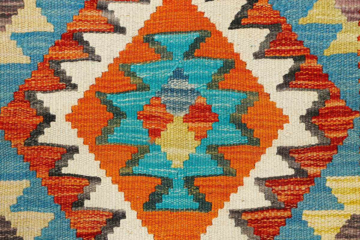 Afghan Kilim runner rug by eastofhere, 216 x 69cm, showcasing vibrant geometric patterns and traditional woven craftsmanship.