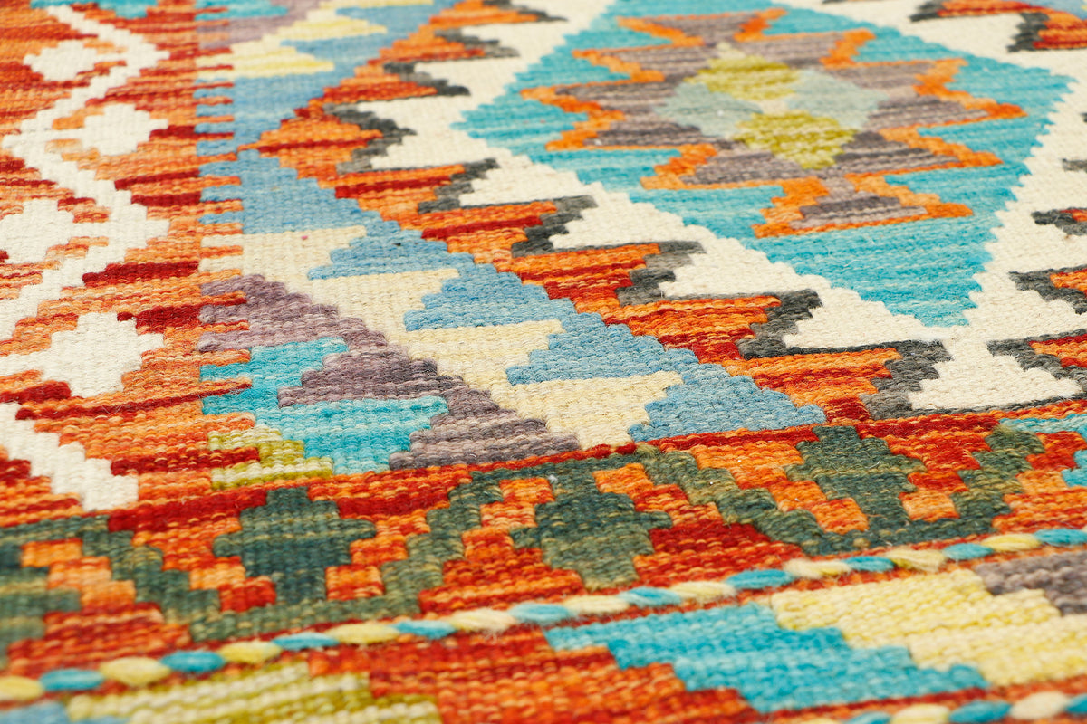 Afghan Kilim runner rug by eastofhere, 216 x 69cm, featuring traditional geometric patterns in vibrant colors.