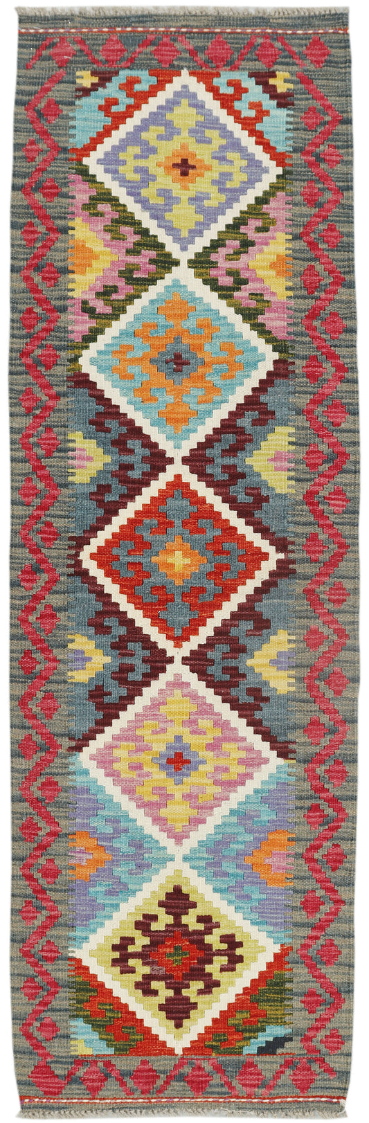 Afghan Kilim runner rug by eastofhere, 191x58cm, featuring traditional geometric patterns in vibrant colors on woven fabric.