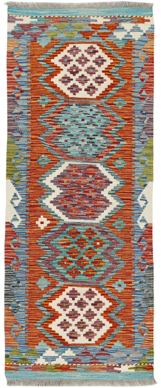 Afghan Kilim runner rug by eastofhere, 157x62cm with geometric patterns and vibrant colors, on a wooden floor.