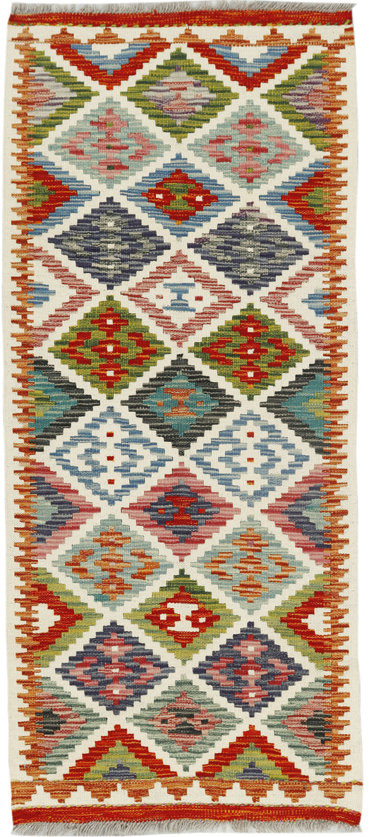 Colorful Afghan Kilim runner rug by eastofhere, 140x60cm with geometric patterns and traditional weaving details.