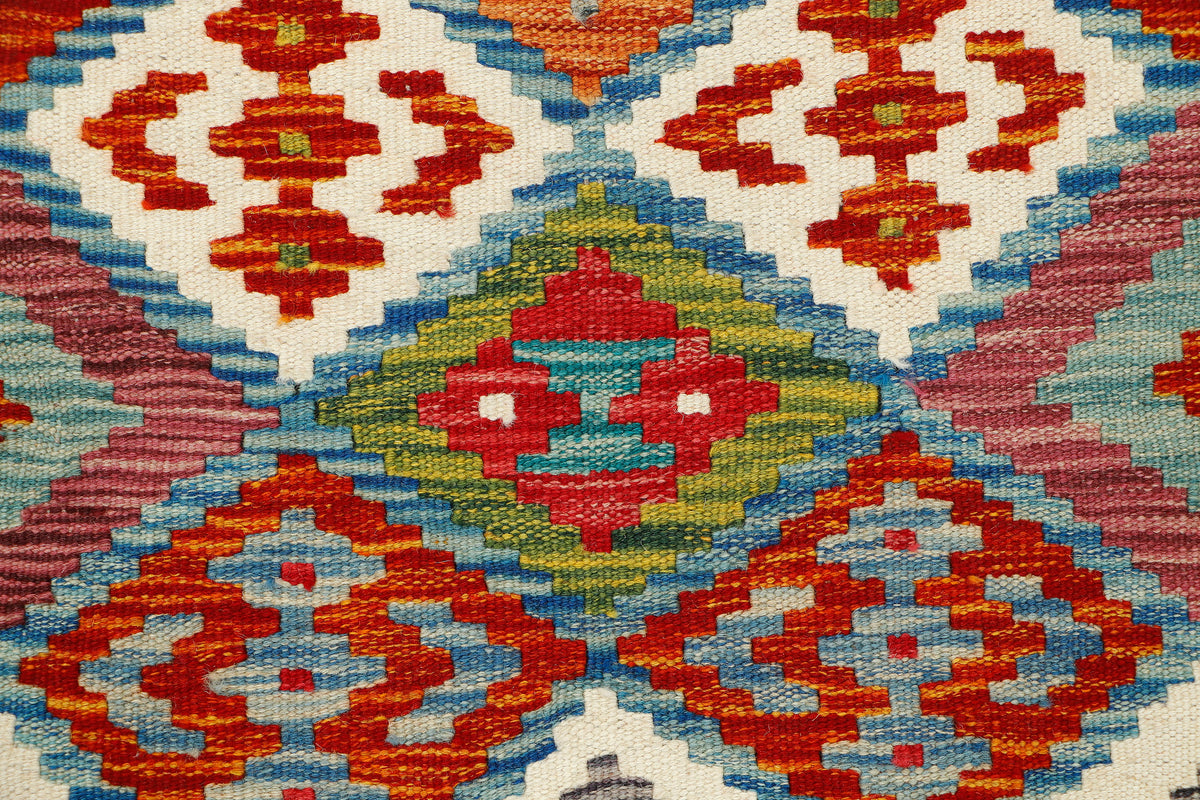 Afghan Kilim rug runner by eastofhere, 163x62cm, featuring traditional geometric patterns and vibrant colors on woven textile.