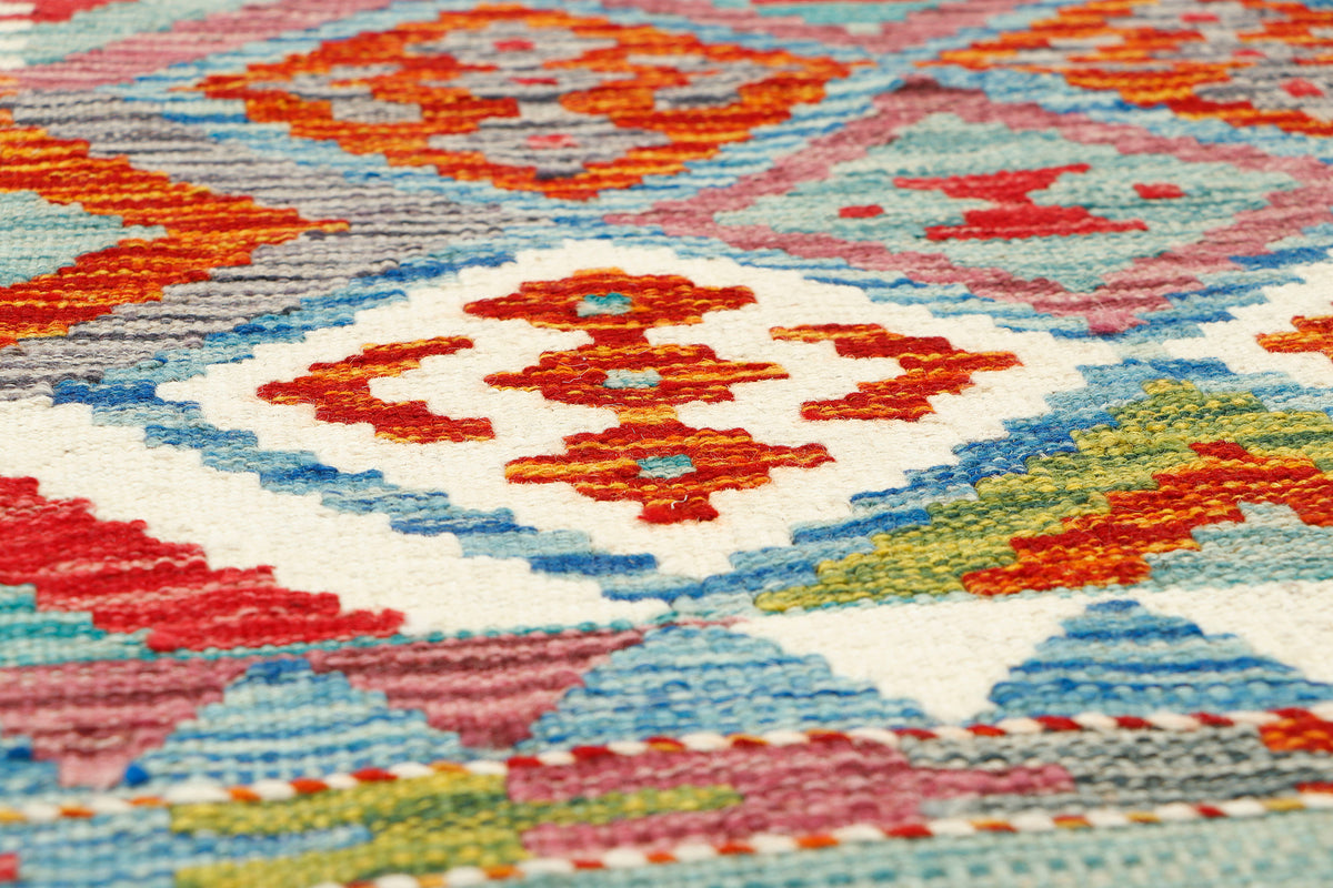 Afghan Kilim runner rug by eastofhere, 163x62cm, featuring traditional geometric patterns and vibrant woven textile details.