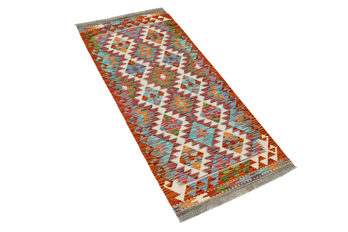 Afghan Kilim runner rug by eastofhere, 62x148cm, featuring vibrant traditional geometric patterns on woven textile.