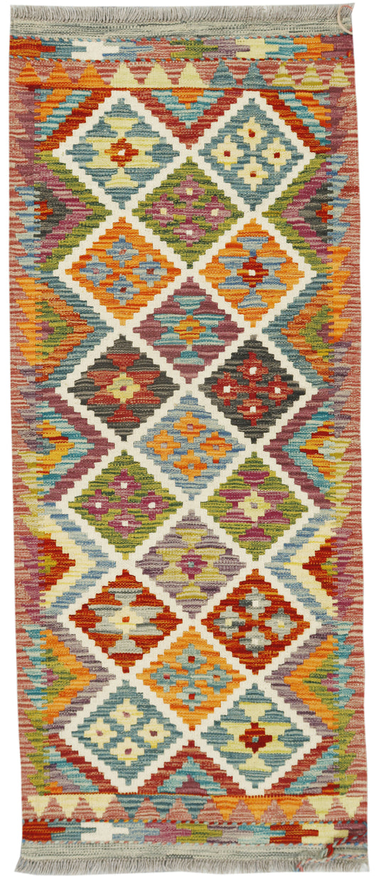 Afghan Kilim runner rug by eastofhere, 154x65cm, featuring traditional geometric patterns and vibrant colors on the woven surface.