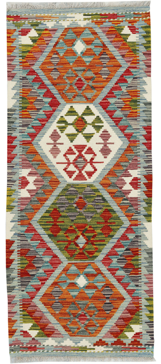 Afghan Kilim runner rug by eastofhere, 150x61cm with vibrant traditional geometric patterns displayed on a wooden floor.