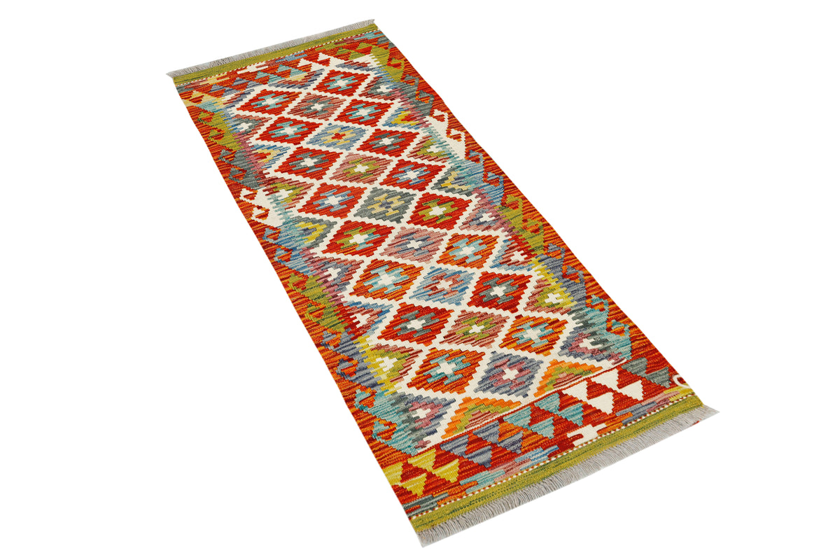 Afghan Kilim runner rug by eastofhere with intricate geometric patterns in warm earthy tones, measuring 149x61cm.