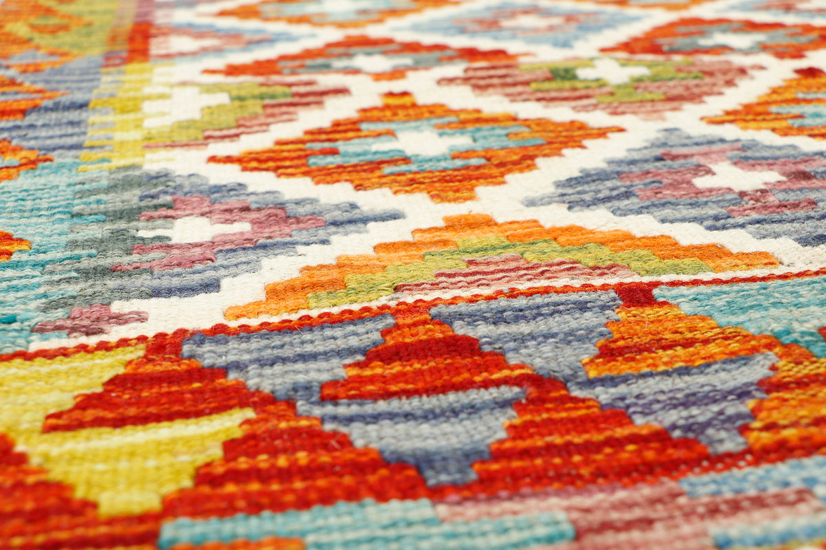 Afghan Kilim runner rug by eastofhere, 149cm long and 61cm wide, featuring traditional geometric patterns in vibrant colors.