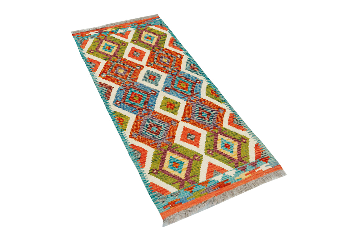 Afghan Kilim runner rug by eastofhere, 148x62cm with traditional geometric patterns and vibrant colors on woven fabric.