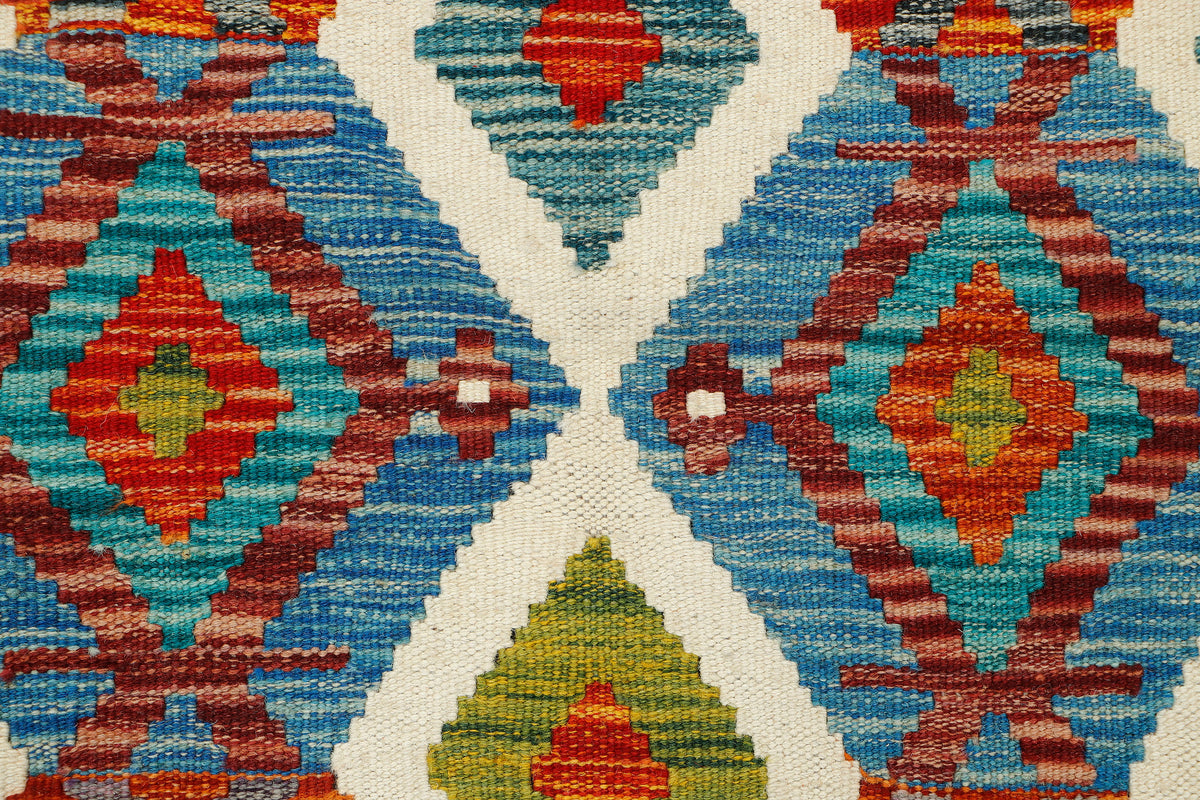 Afghan Kilim runner rug by eastofhere, 148x62cm, featuring traditional geometric patterns in vibrant colors.