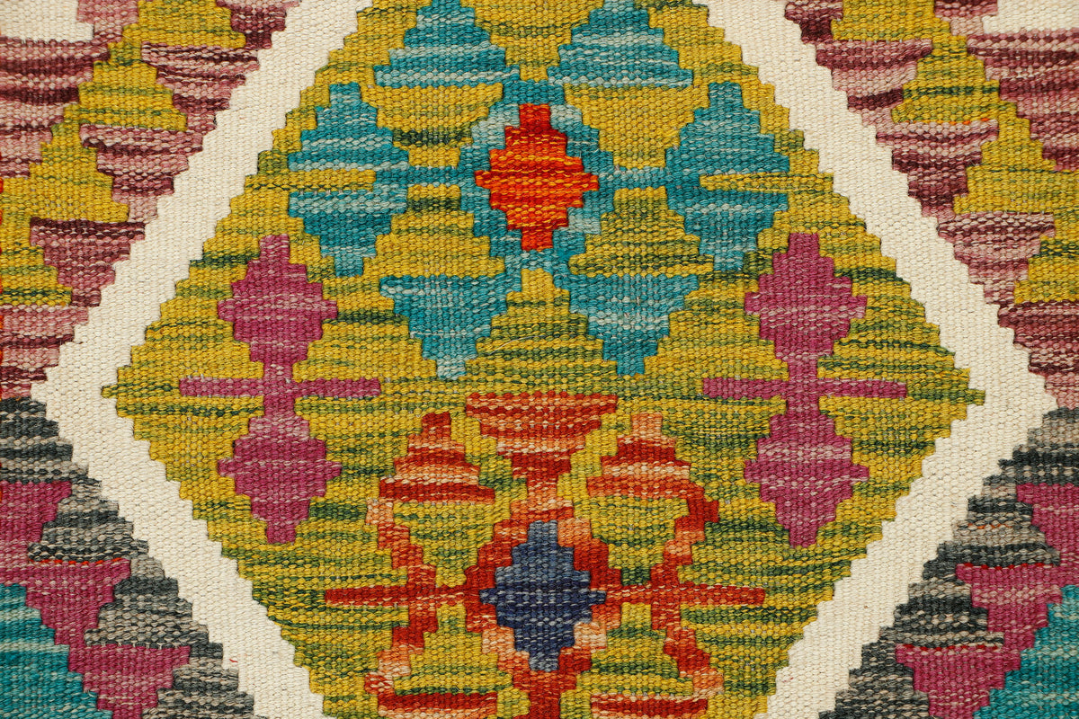 Afghan Kilim runner rug by eastofhere, 155x59cm, featuring colorful geometric patterns on woven textile.