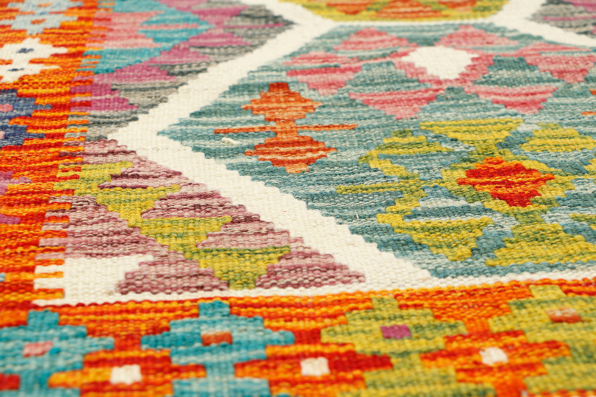 Colorful Afghan Kilim runner rug by eastofhere, 155x59cm, showcasing traditional geometric patterns and vibrant woven design.