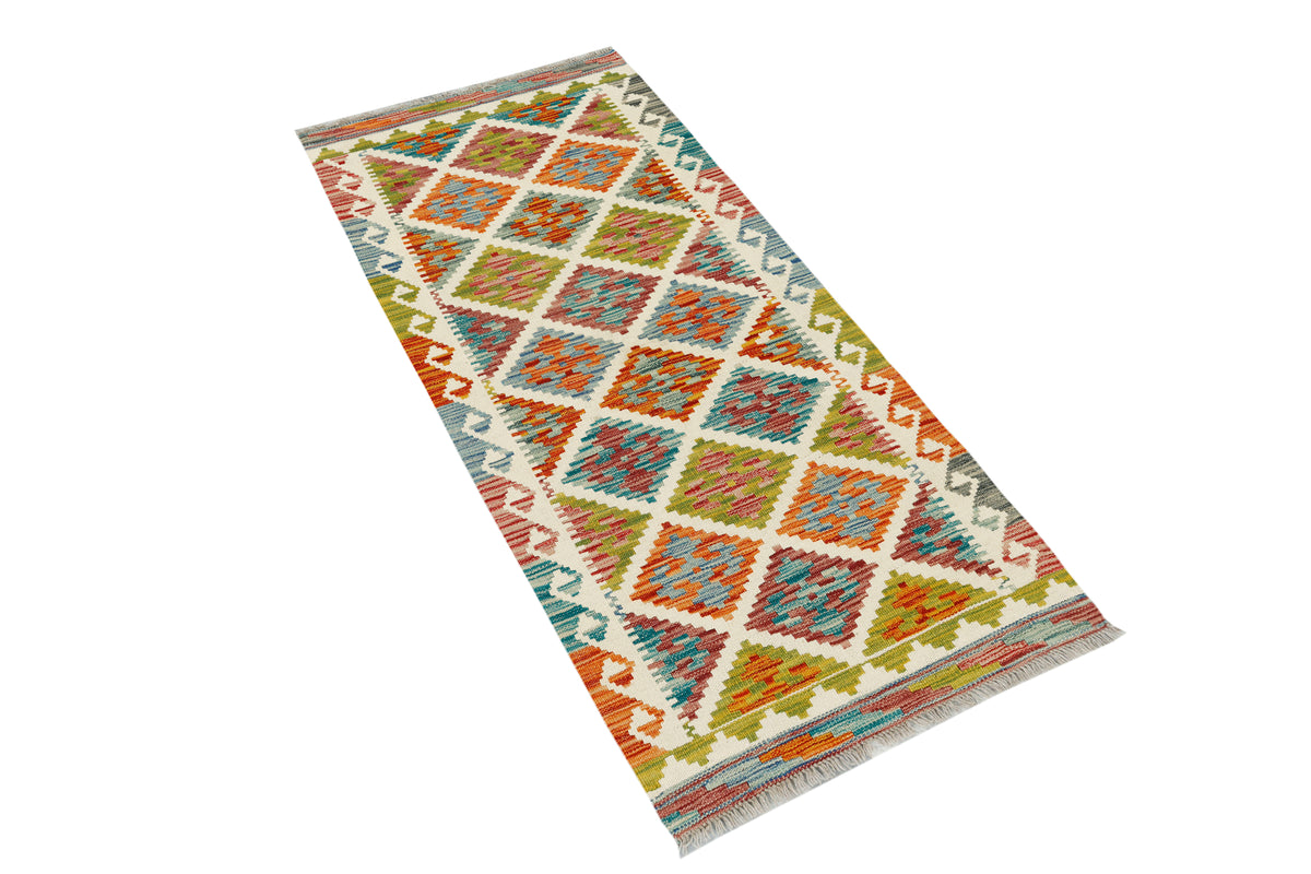 Afghan Kilim runner rug by eastofhere, 145x64cm, featuring vibrant traditional geometric patterns on woven textile.