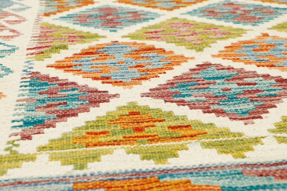 Afghan Kilim runner rug by eastofhere, 145x64cm, featuring traditional geometric patterns and vibrant woven colors.