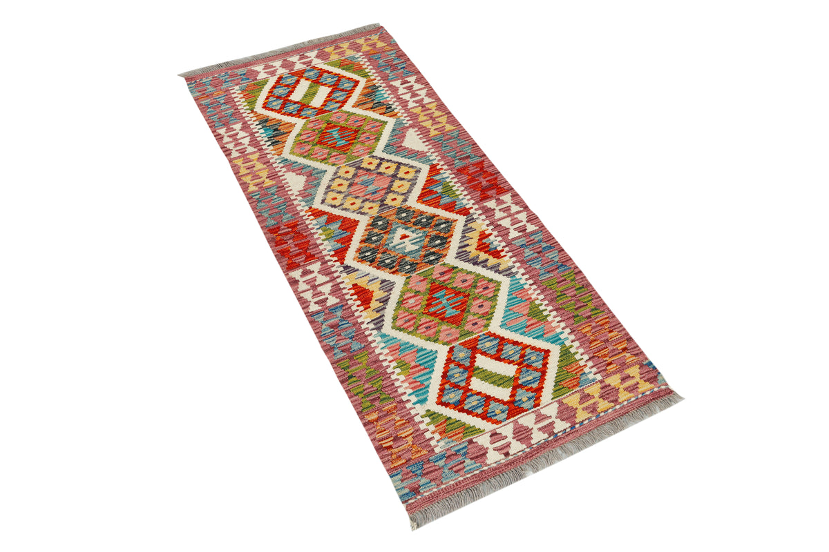 Afghan Kilim runner rug by eastofhere, 145x62cm, featuring traditional geometric patterns and vibrant colors.