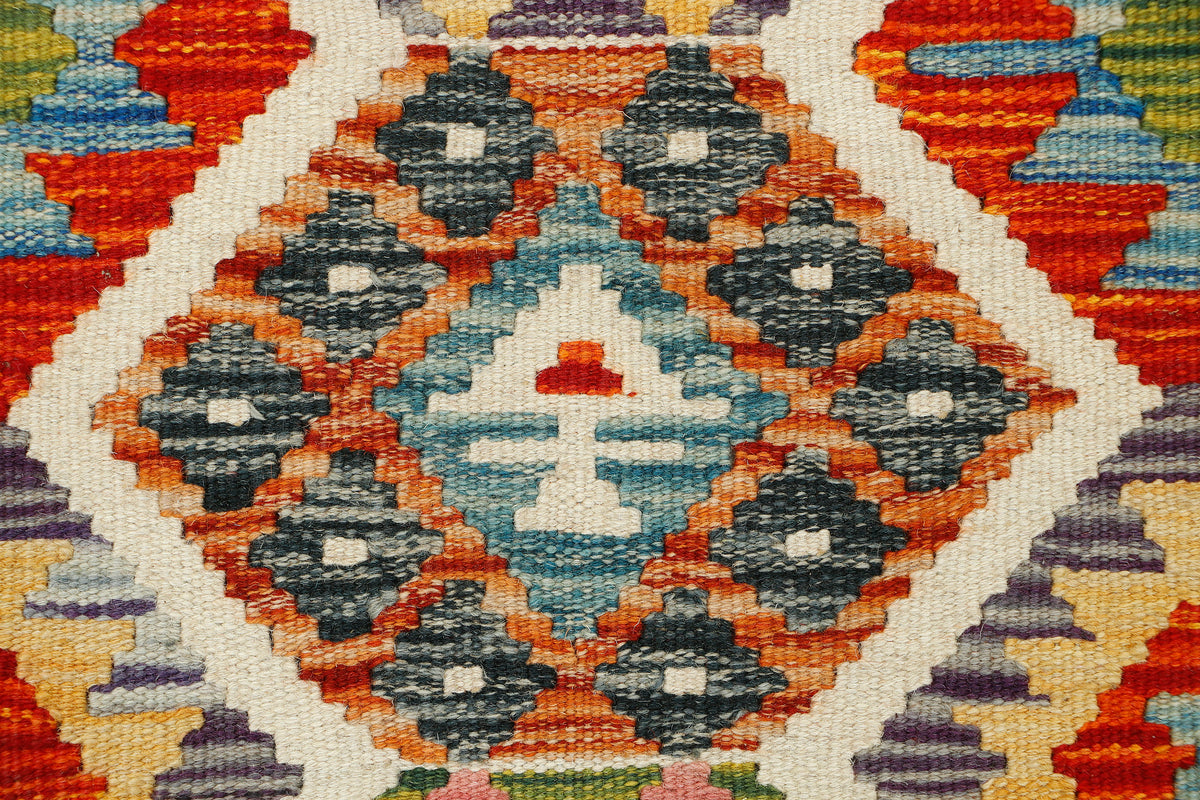Afghan Kilim runner rug by eastofhere, 145x62cm, featuring traditional geometric patterns and vibrant colors on a woven textile.