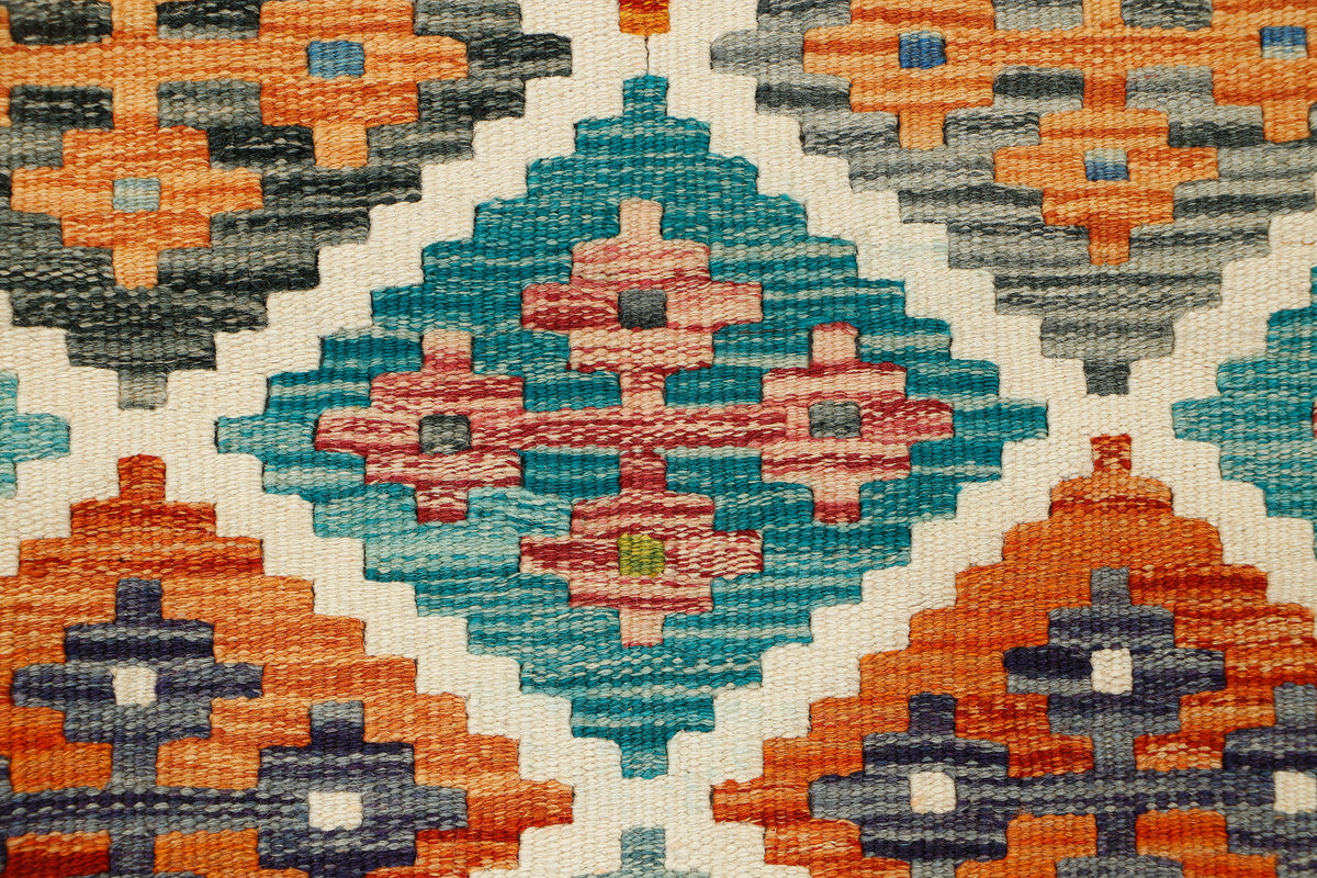 Afghan Kilim runner rug by eastofhere, 62cm wide and 141cm long, featuring traditional woven geometric patterns and vibrant colors.