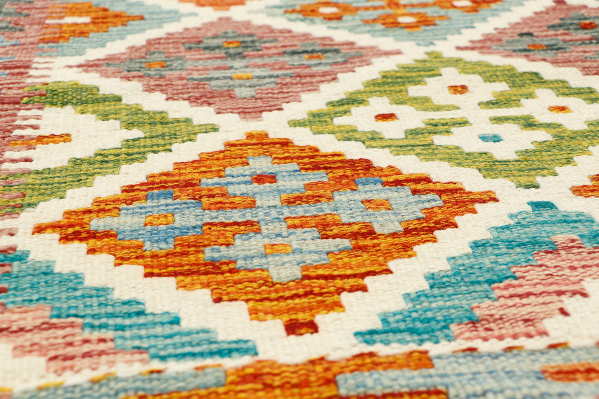 Afghan Kilim runner rug by eastofhere, 62cm wide and 141cm long, featuring colorful geometric patterns on woven textile.