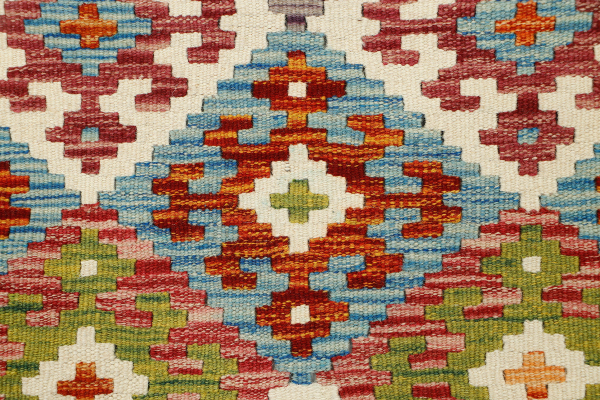 Afghan Kilim runner rug by eastofhere, 151x58cm, featuring traditional geometric patterns in vibrant colors on a woven textile.