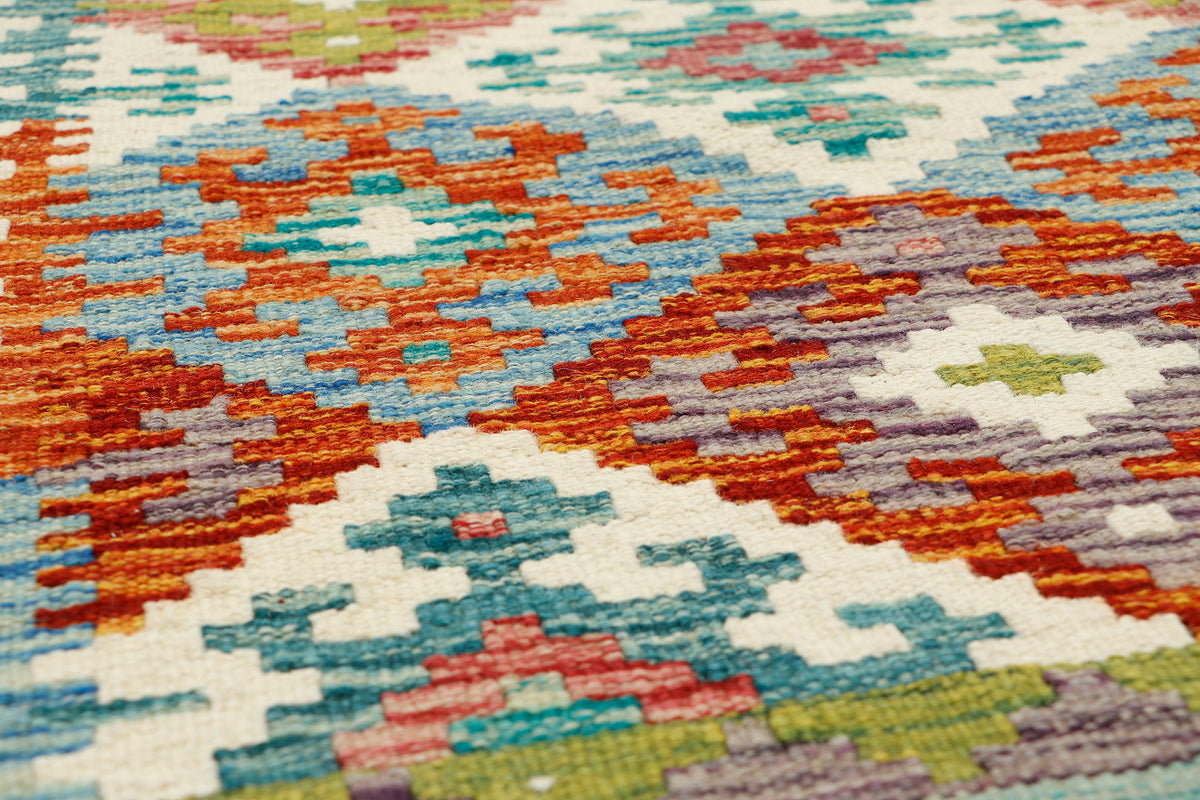 Afghan Kilim runner rug by eastofhere, 151x58cm with vibrant geometric patterns and traditional woven design.