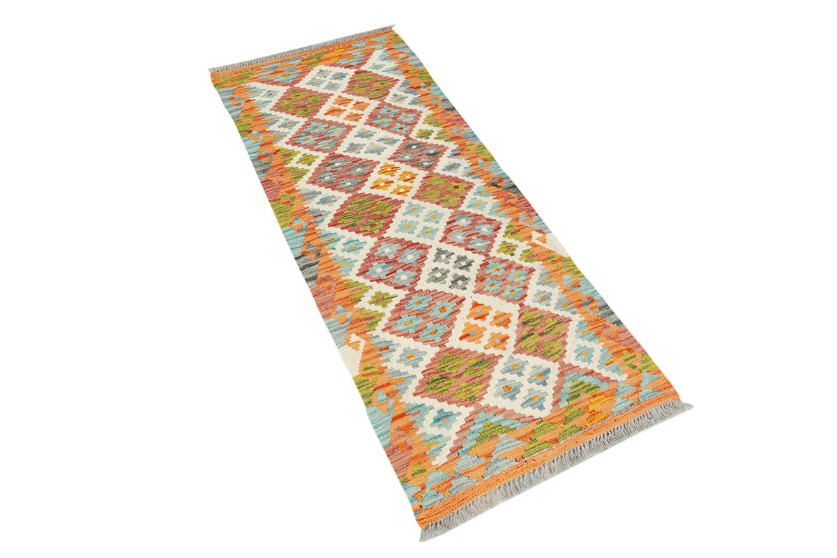 Afghan Kilim runner rug by eastofhere, 145x57cm, featuring traditional geometric patterns in vibrant earthy tones.