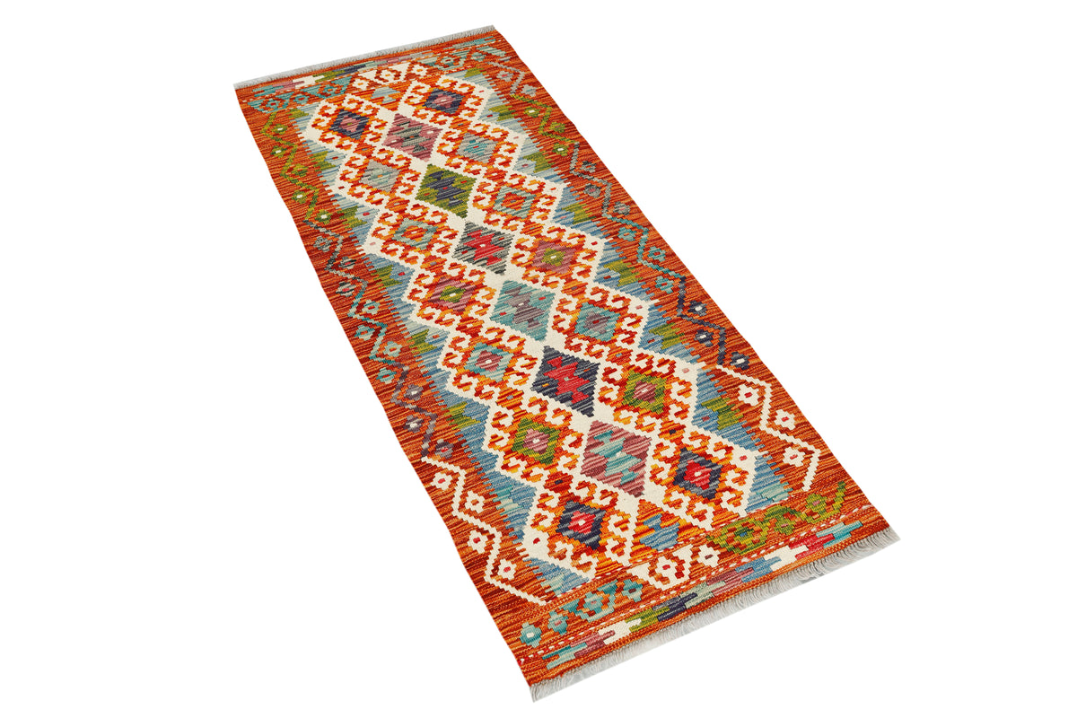 Afghan Kilim runner rug by eastofhere featuring vibrant geometric patterns, measuring 146x62cm, laid out on a wooden floor.