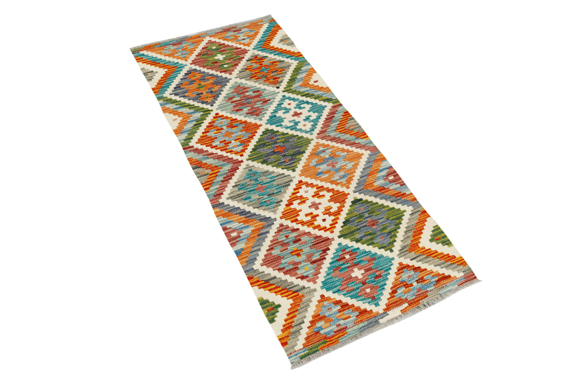 Afghan Kilim runner rug by eastofhere, 142 x 60cm, featuring traditional geometric patterns in vibrant colors.