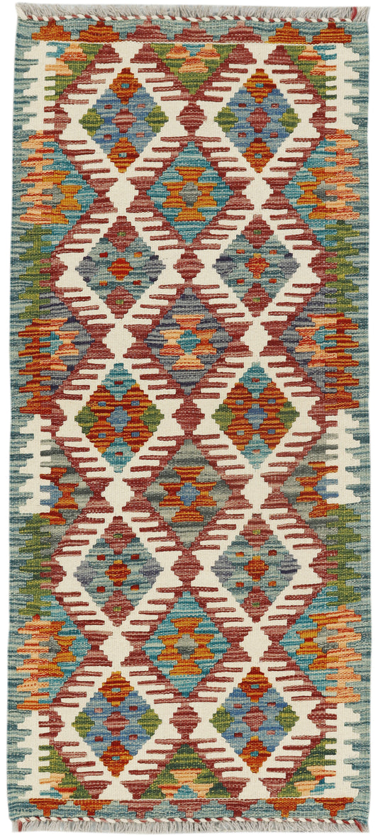 Afghan Kilim runner rug by eastofhere, 141x63cm, featuring traditional geometric patterns in vibrant colors.