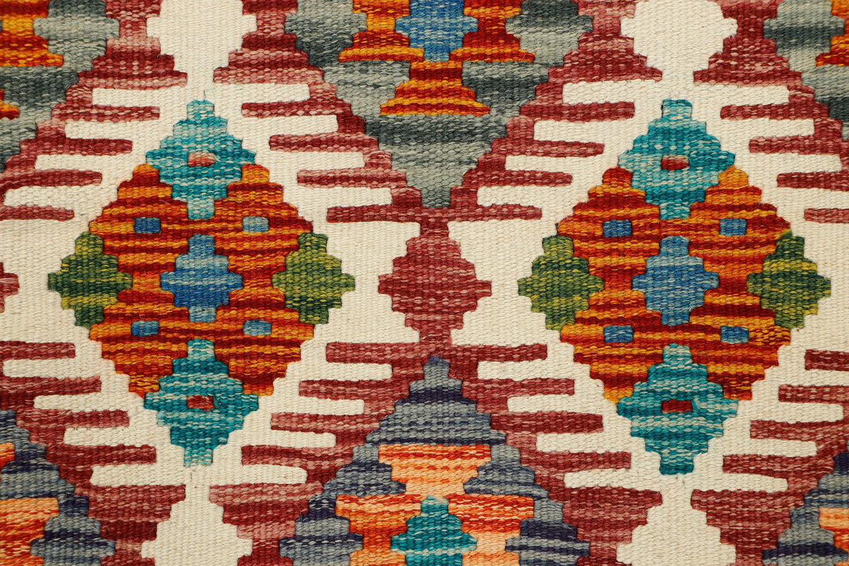 Afghan Kilim Runner rug by eastofhere with geometric patterns in warm earthy tones, measuring 141x63cm.